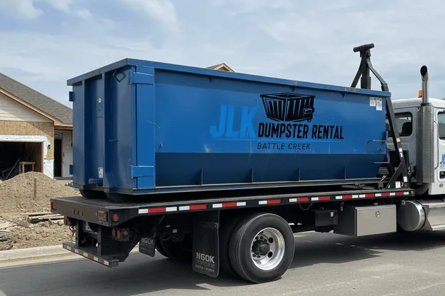 Seasonal dumpster delivery in Battle Creek Roll-off container delivered in winter conditions in Battle Creek, MI